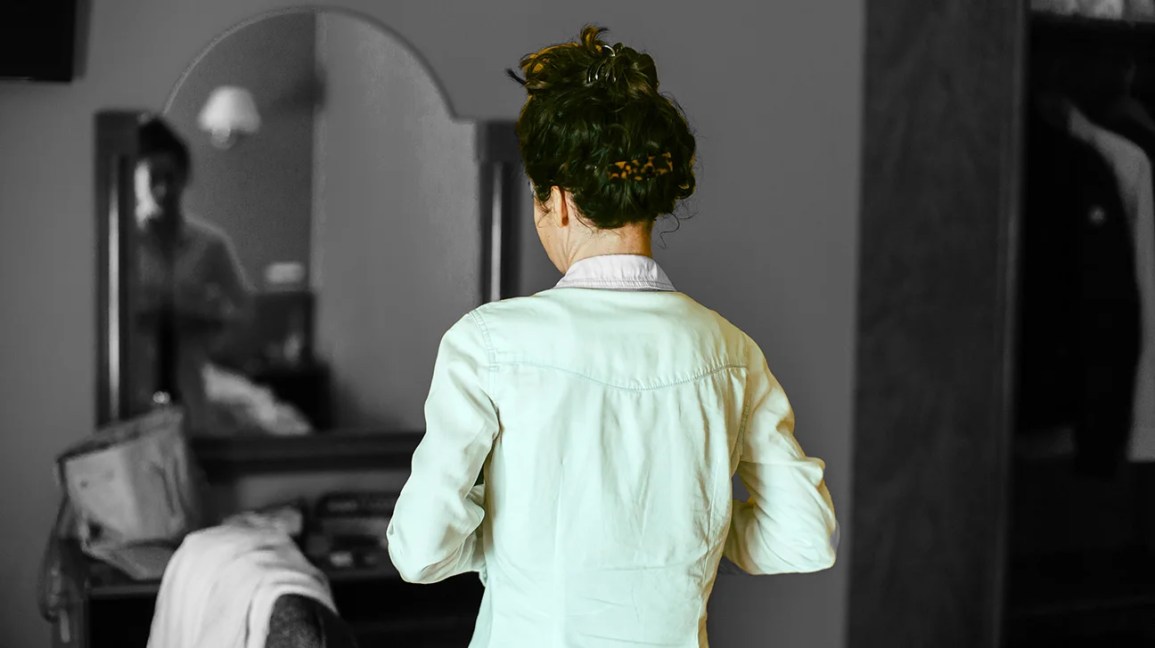 a woman with bipolar disorder looking into a mirror
